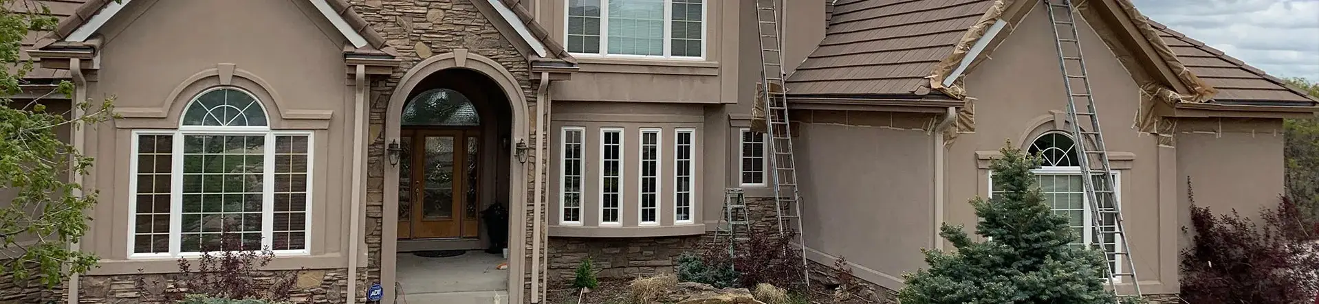 Commercial exterior painting project with sheds